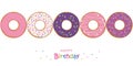 Happy birthday greeting card with colorful donuts and sprinkles Royalty Free Stock Photo