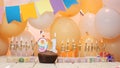 Happy birthday greetings for 91 years of gold letters of candles burning against the background of mine space balloons. Royalty Free Stock Photo