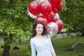 Happy birthday. happy woman with party birthday baloons outdoor in summer.