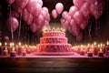 Happy birthday letters shine in pink glory against candlelit ambiance