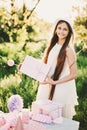 Happy birthday little girl with pink decor in beautiful garden Royalty Free Stock Photo