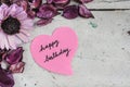 Happy birthday note in heart shape paper with pink flowers