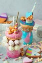 Freak shakes topping with donut, marshmallow decorated as unicorn