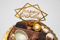 Happy birthday sign on homemade delicious birthday chocolate cake on light table with, close up Royalty Free Stock Photo