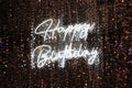 Happy Birthday sign in neon with glitter Royalty Free Stock Photo