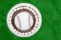 Happy Birthday Slugger baseball cake on a green fake grass