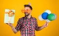 happy birthday to you. male holiday celebration. bearded guy with party balloons and gift box. unshaven handsome man Royalty Free Stock Photo