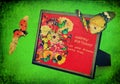 Happy Birthday. Wooden frame with gorgeous colorful flowers and Greeting words. Lovely butterfly and lady bug fly around