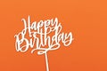 Happy birthday wooden text concept isolated on orange background