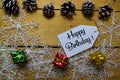 Happy Birthday write on label with wooden backgroud. Frame of Christmas Decoration Royalty Free Stock Photo