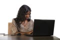 Happy black afro American business woman working cheerful with laptop computer by business district window desk in corporate Royalty Free Stock Photo