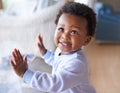 Happy black baby boy, childhood development and child with smile standing against window at family home. Happiness with Royalty Free Stock Photo