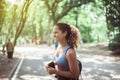 Happy black beautiful woman standing and resting after break workout at park,Positive thinking and smiling,Relaxing time Royalty Free Stock Photo