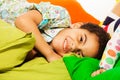Happy black boy laying on the pillows Royalty Free Stock Photo