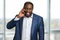 Happy black businessman making a call. Royalty Free Stock Photo