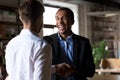 Happy black ceo handshaking rewarding successful worker, employe Royalty Free Stock Photo