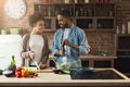 Happy black couple cooking dinner together Royalty Free Stock Photo