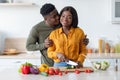 Happy black couple cooking healthy food together at home Royalty Free Stock Photo