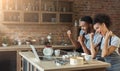 Happy black couple cooking pastry looking on laptop Royalty Free Stock Photo