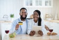 Happy Black Couple With Digital Tablet And Credit Card Posing In Kitchen Royalty Free Stock Photo