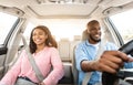 Happy black couple enjoying long drive on luxury car Royalty Free Stock Photo