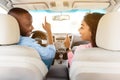 Happy black couple enjoying music driving nice car Royalty Free Stock Photo