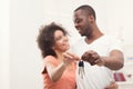 Happy black couple holding keys of their new home Royalty Free Stock Photo