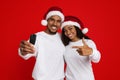 Happy black couple in Santa hats holding car key Royalty Free Stock Photo