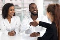 Happy black couple signing mortgage contract get new house keys Royalty Free Stock Photo