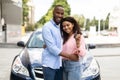Happy black couple standing near car showing auto keys Royalty Free Stock Photo