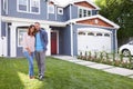 Happy black couple standing outside their house Royalty Free Stock Photo