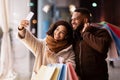 Happy black couple taking selfie after shopping in the city Royalty Free Stock Photo