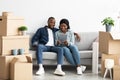 Happy Black Couple Using Digital Tablet Together After Moving To New Home Royalty Free Stock Photo