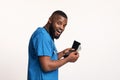 Happy black doctor counting money in his wallet Royalty Free Stock Photo