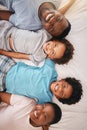 Happy black family, bed portrait and top view with happiness, kids and together with dad, mom and love. African children Royalty Free Stock Photo