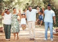 Happy black family bonding and having fun at a park together, laughing and playful holding hands on active walk in Royalty Free Stock Photo