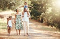 Happy black family bonding on an outdoor work in a park, loving and having fun together. African American parents Royalty Free Stock Photo