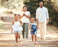 Happy, black family and children running in nature park in summer as mom and dad cheer their young African kids on Royalty Free Stock Photo