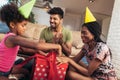 Happy black family at home. African american father, mother and child celebrating birthday, having fun at party. Royalty Free Stock Photo