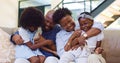 Happy, black family and hug with love on sofa with children and parents together laughing in home. African, mother and