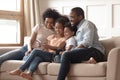 Happy black family with kids relax on sofa with tablet Royalty Free Stock Photo