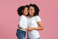 Happy Black Family, Mom And Daughter, Hugging And Smiling At Camera