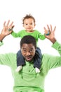Happy black father and child boy cuddling on isolated white background. Royalty Free Stock Photo