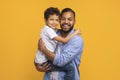 Happy black father lifting his little son and hugging Royalty Free Stock Photo