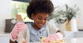 Happy black girl, cleaning table and housekeeping for hygiene, disinfection or chores at home. African female person Royalty Free Stock Photo