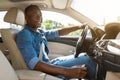Happy black guy driving car, going to job Royalty Free Stock Photo
