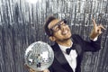 Happy funny young black guy in tuxedo and glasses dancing and having fun at party Royalty Free Stock Photo