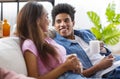 Happy black guy looking at his girlfriend with admiring glance Royalty Free Stock Photo