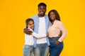 Happy black guy posing with wife and smiling teen daughter Royalty Free Stock Photo