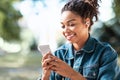 Happy Black Lady Using Smartphone Texting Sitting In Park Outdoor Royalty Free Stock Photo